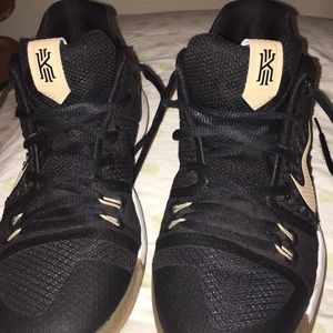 Black and gold Kyrie 3s